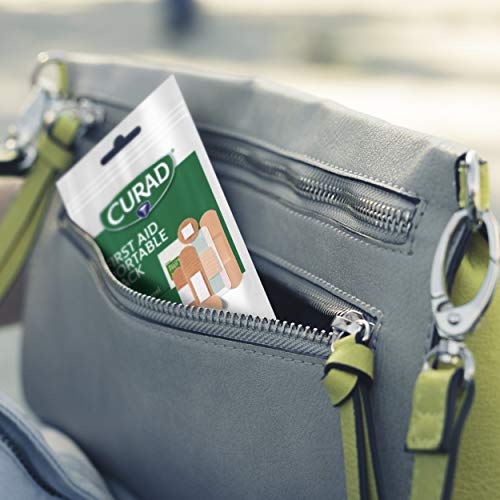 Curad First Aid Portable Pack, Ideal for Travel, Carry-on, Backpacks, Water Resistant Pouch, Variety Size Bandages, Alcohol Swabs, 12 Packs